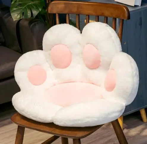 Fluffy cat paw cushion seat in white and pink, perfect for cozy seating at home