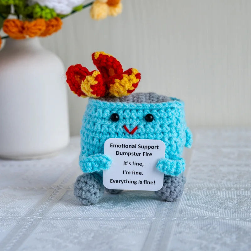 Handmade crochet emotional support buddies in the shape of a cute dumpster fire with a smiling face