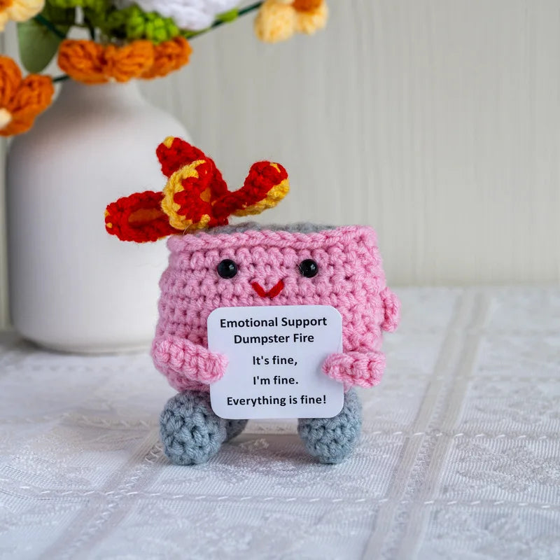Handmade crochet emotional support buddies designed as cute character with a sign saying Everything is fine