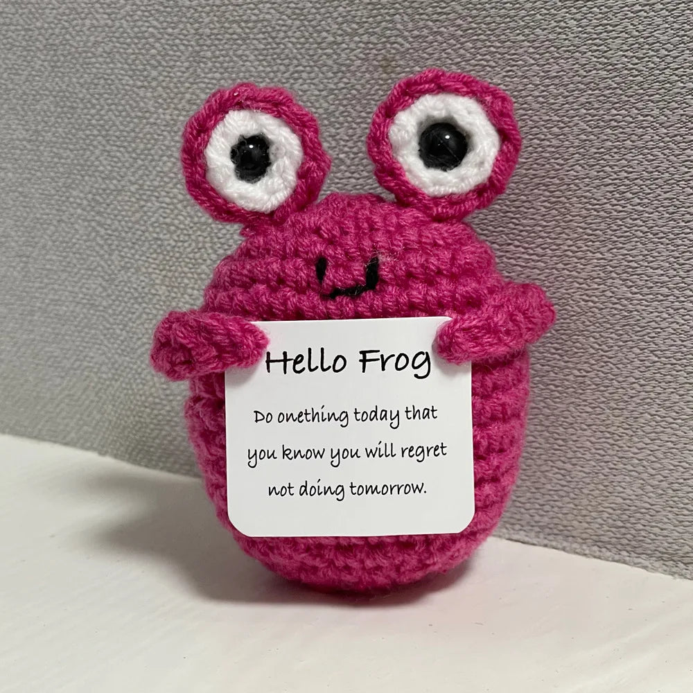 Handmade crochet emotional support buddies pink frog holding a motivational message card