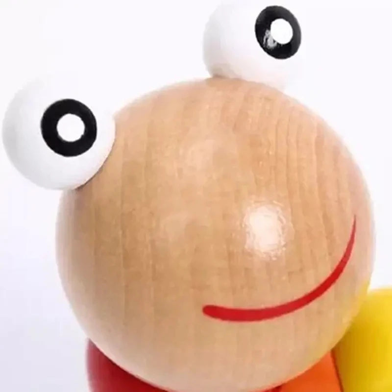 Cute wooden toy featuring a smiling face inspired by the Hungry Caterpillar wooden toy