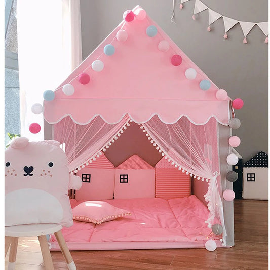 ActivePlaythings small house play tent in pink with decorative pom poms and cozy cushions for kids