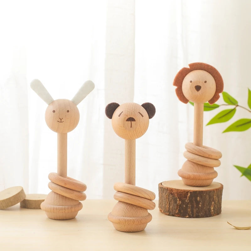 Cute wooden therapeutic baby rattles featuring bunny, panda, and lion designs for sensory play