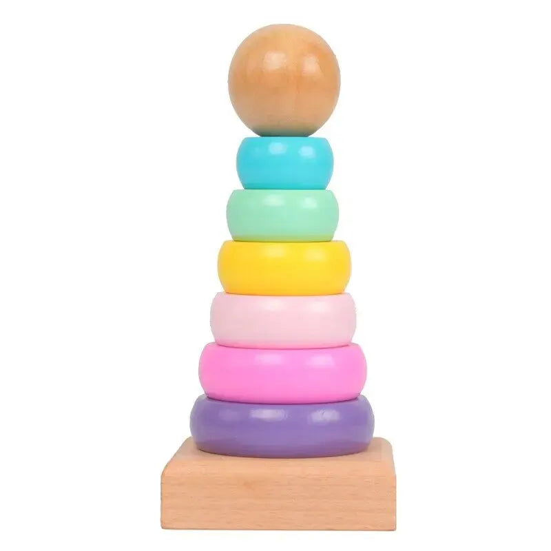 Colorful wooden rainbow stacking tower with seven rings and a ball on top for kids' playtime
