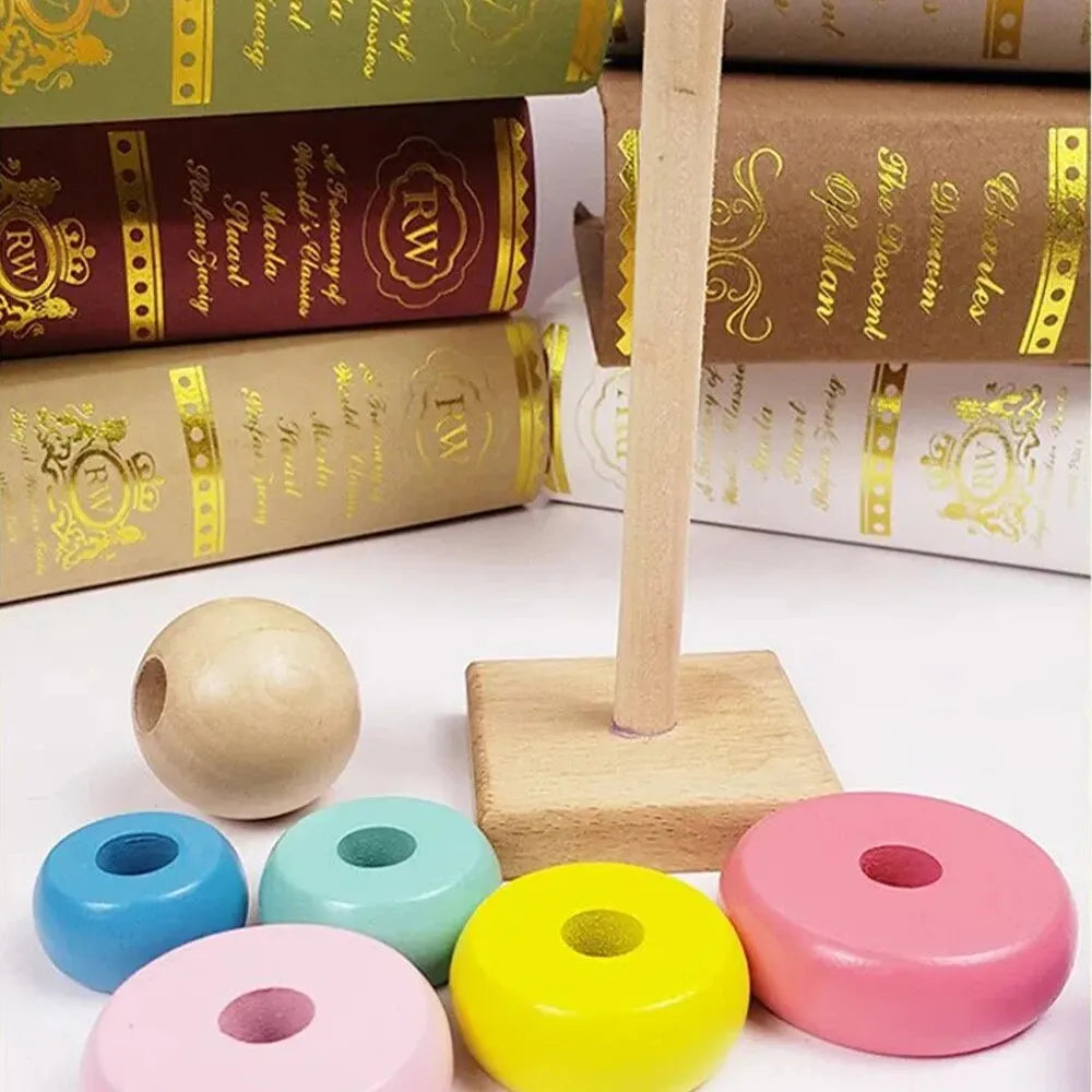 Wooden rainbow stacking tower with colorful rings and a wooden base for active play