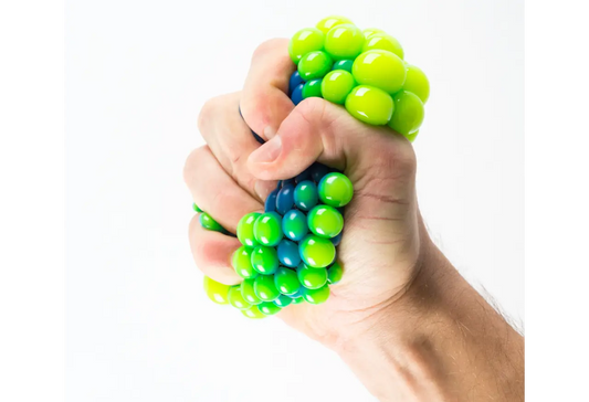 Hand squeezing colorful stress relief toy highlighting the benefits of fidget toys for adults