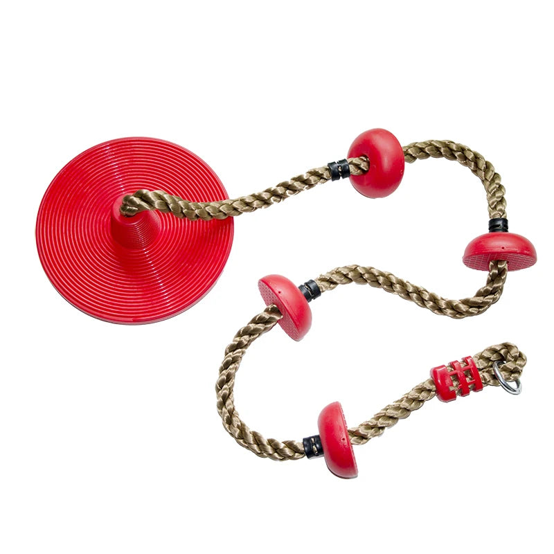 Red disc seat swing with knotted climbing rope