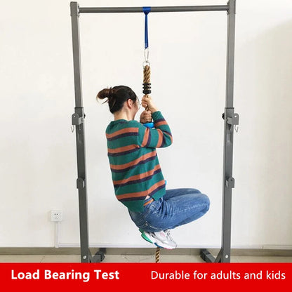 Kids climbing rope swing with disc footholds, view 3