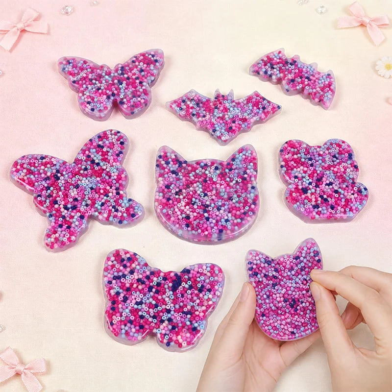 Animal skin picking pads in cat, butterfly, bat, and bear shapes