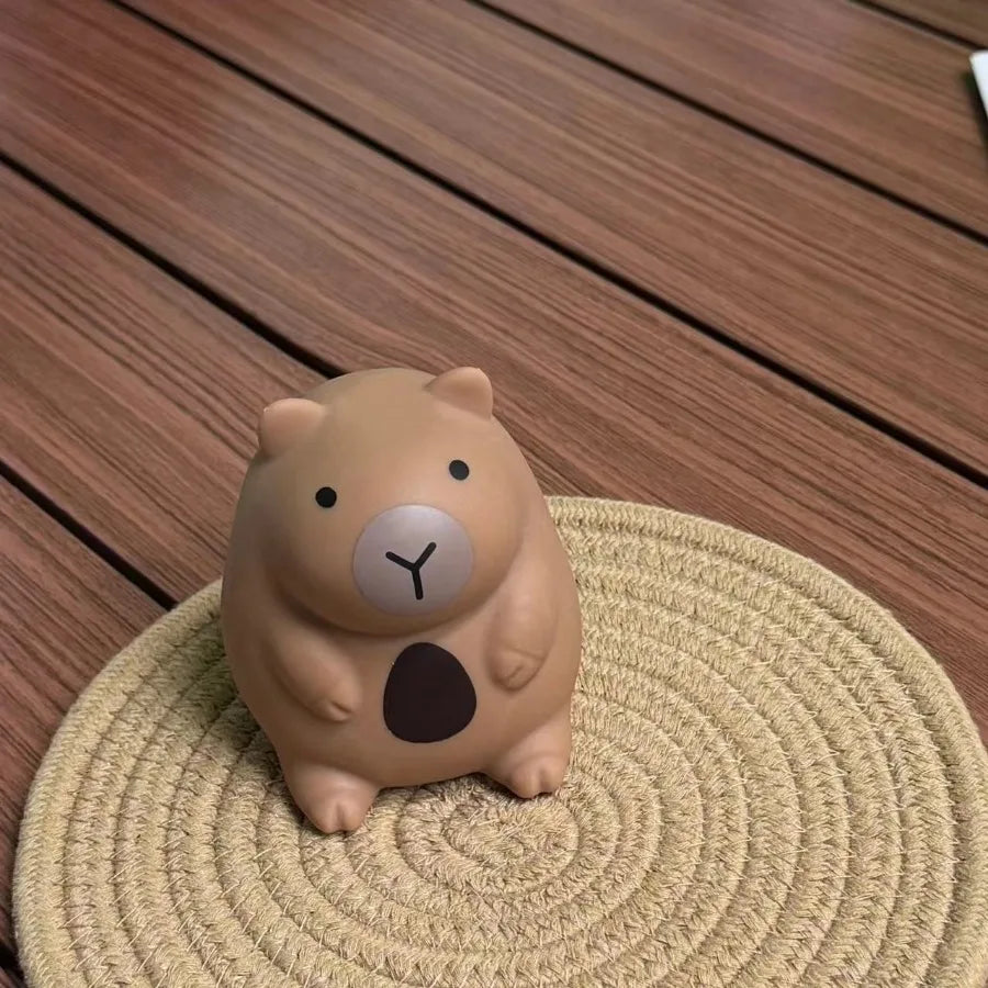 Chubby capybara squeeze toy held in hand