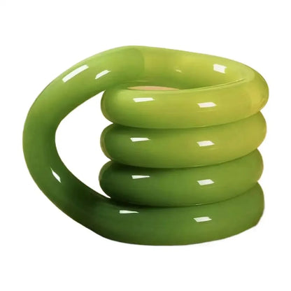 Thermochromic tangle fidget toy bent into a shape