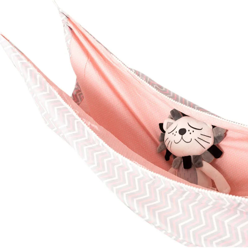 Blush Pink sensory swing hammock for kids with plush toy, side view