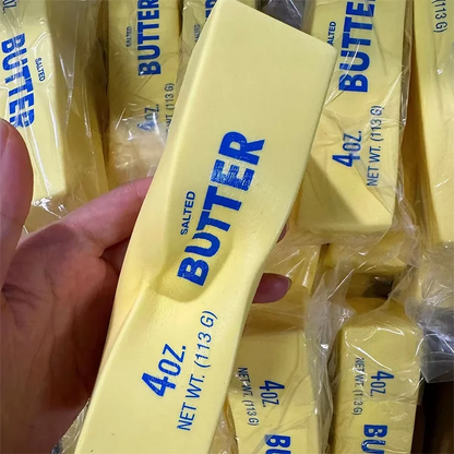 Butter squishy stick bent in hand