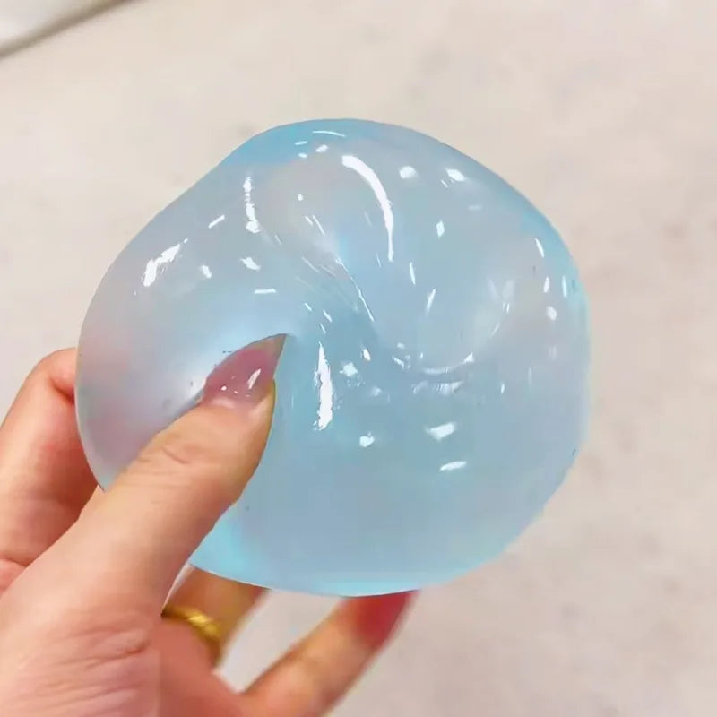 Blue mochi squishy stress ball being squeezed