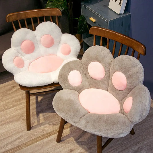 Two soft cat paw cushion seat designs in gray and white, perfect for cozy seating