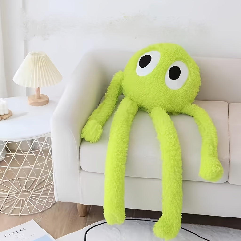 Bright green extra large octopus plush pillow with big eyes on a white couch by side table