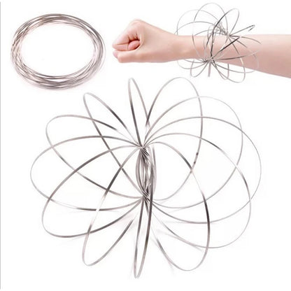 Active Playthings kinetic flow ring toy shown coiled and expanded on arm for sensory play