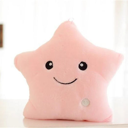 Pink star-shaped glowing LED plush cushion with a smiling face for children's decor and comfort