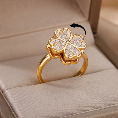 Gold adjustable therapeutic fidget ring with a sparkling four-leaf clover design in a jewelry box