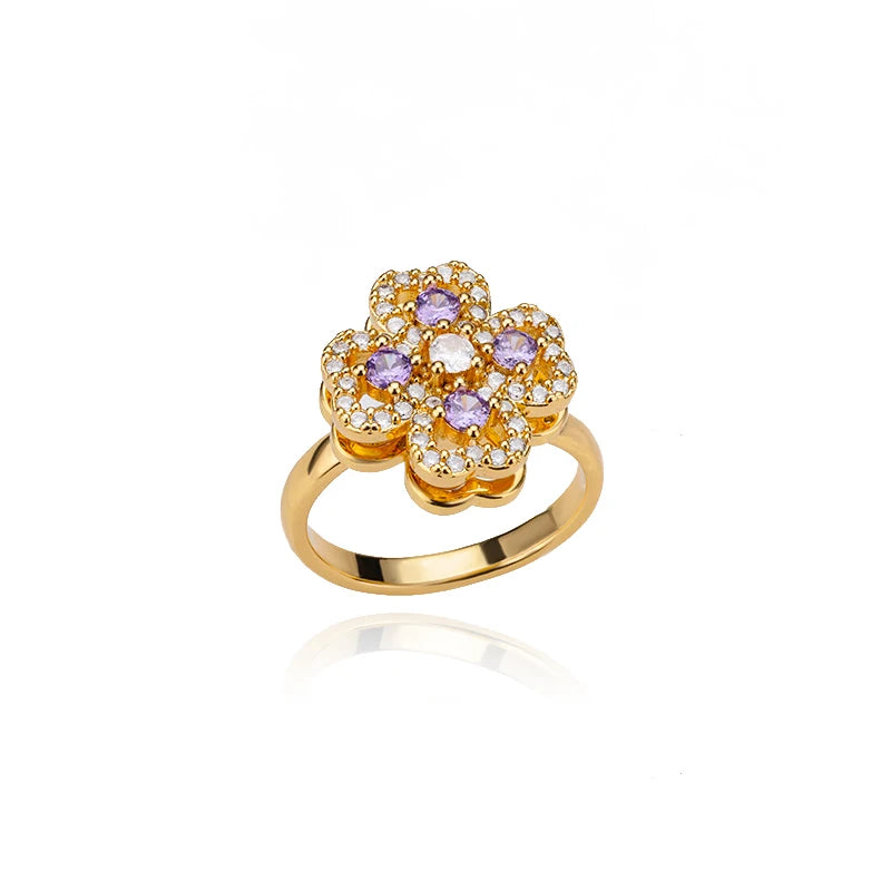 Gold flower design adjustable therapeutic fidget ring with purple and white gemstones by Active Playthings