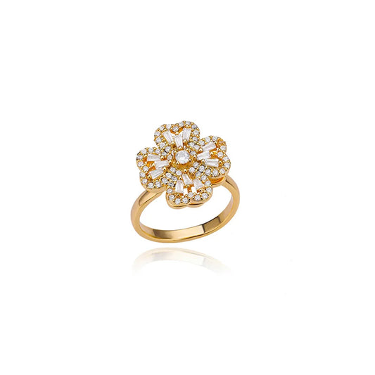 Adjustable therapeutic fidget ring with gold band and flower-shaped design adorned with white stones