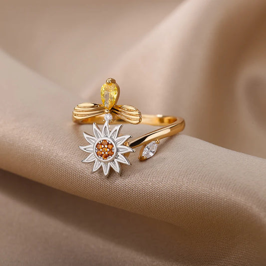 Gold sunflower fidget ring with detailed petals and gemstone accents by Active Playthings