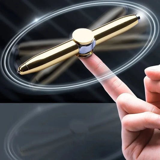 Active Playthings Gyro Pen Fidget Spinner in gold spinning on a fingertip for stress relief