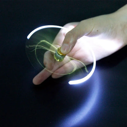 A hand spinning the Gyro Pen Fidget Spinner with glowing LED lights for fun and relaxation