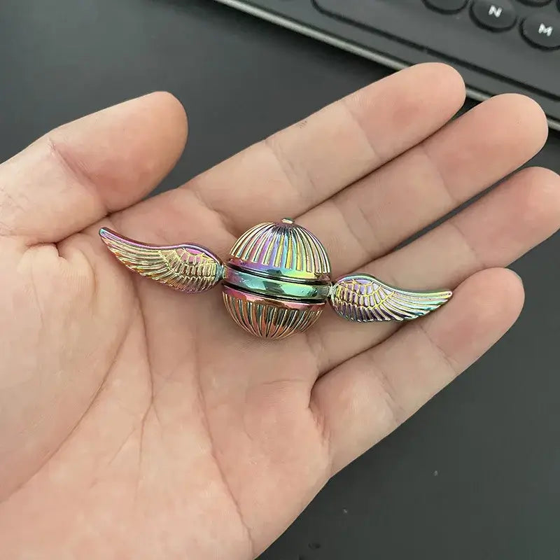 Colorful magical fidget spinner toy with winged design, perfect for stress relief and focus