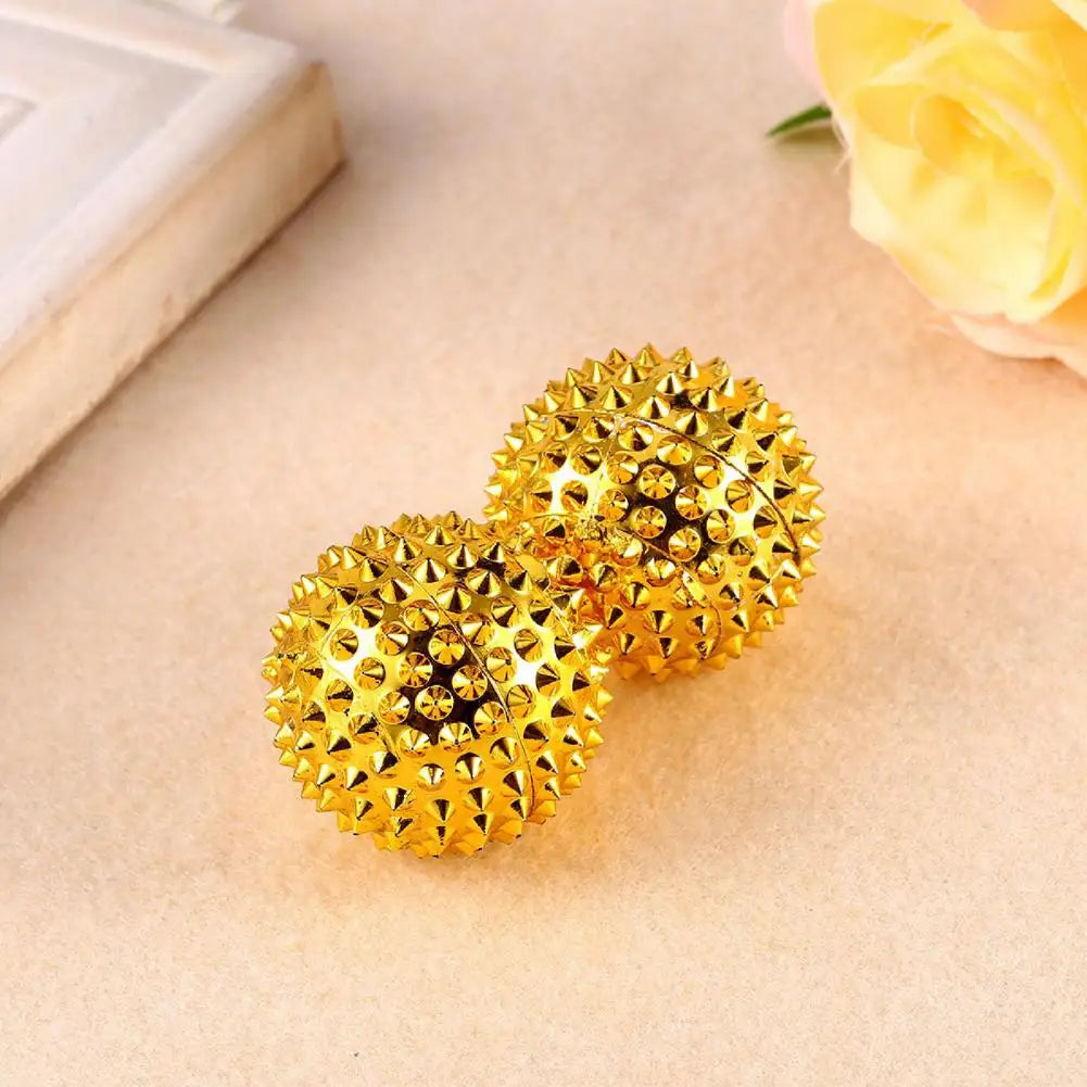 Golden spiked magnetic acupoint massage ball for relaxation and tension relief
