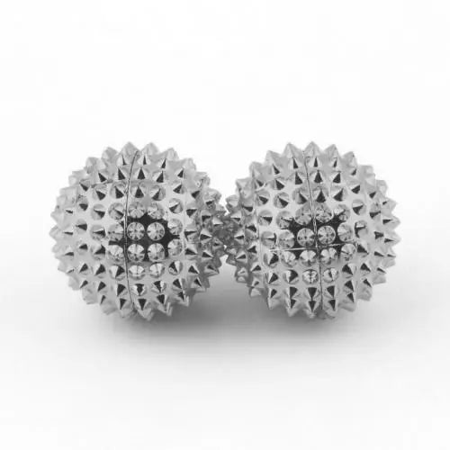 Set of two silver magnetic acupoint massage balls with textured surfaces for enhanced relaxation