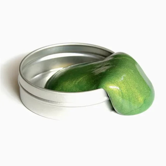 Green magnetic ferrofluid playdough oozing from a silver tin for sensory play and experimentation