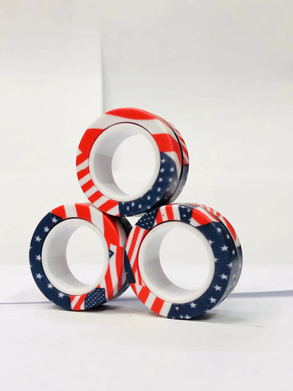 Three colorful magnetic finger ring fidget toys featuring patriotic American flag designs