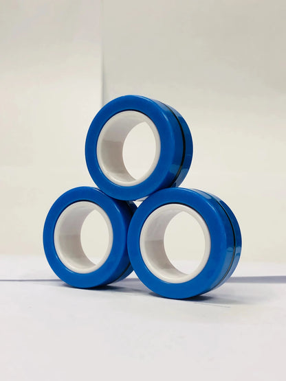 Three blue magnetic finger ring fidget toys stacked in a triangular formation for stress relief and fun