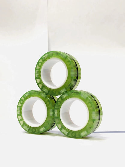 Three green magnetic finger ring fidget toys designed for stress relief and focus enhancement