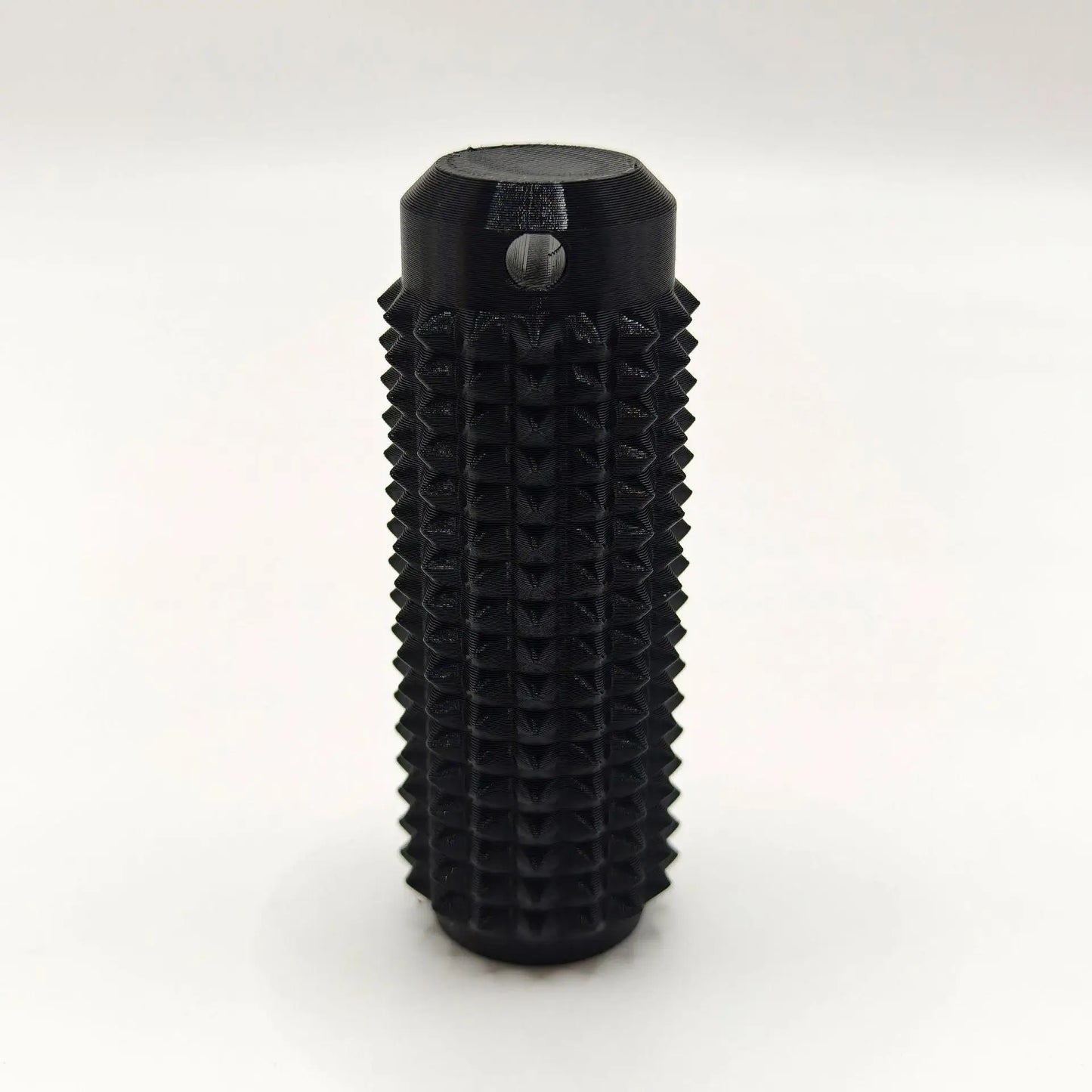 Black mini grippie sensory toy with textured surface for enhanced tactile stimulation
