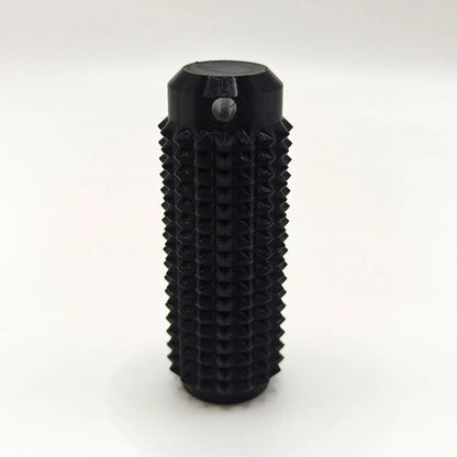 Black mini grippie sensory toy with textured surface for enhanced tactile stimulation