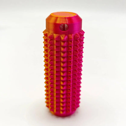 Bright pink and orange mini grippie sensory toy with a textured design for tactile engagement