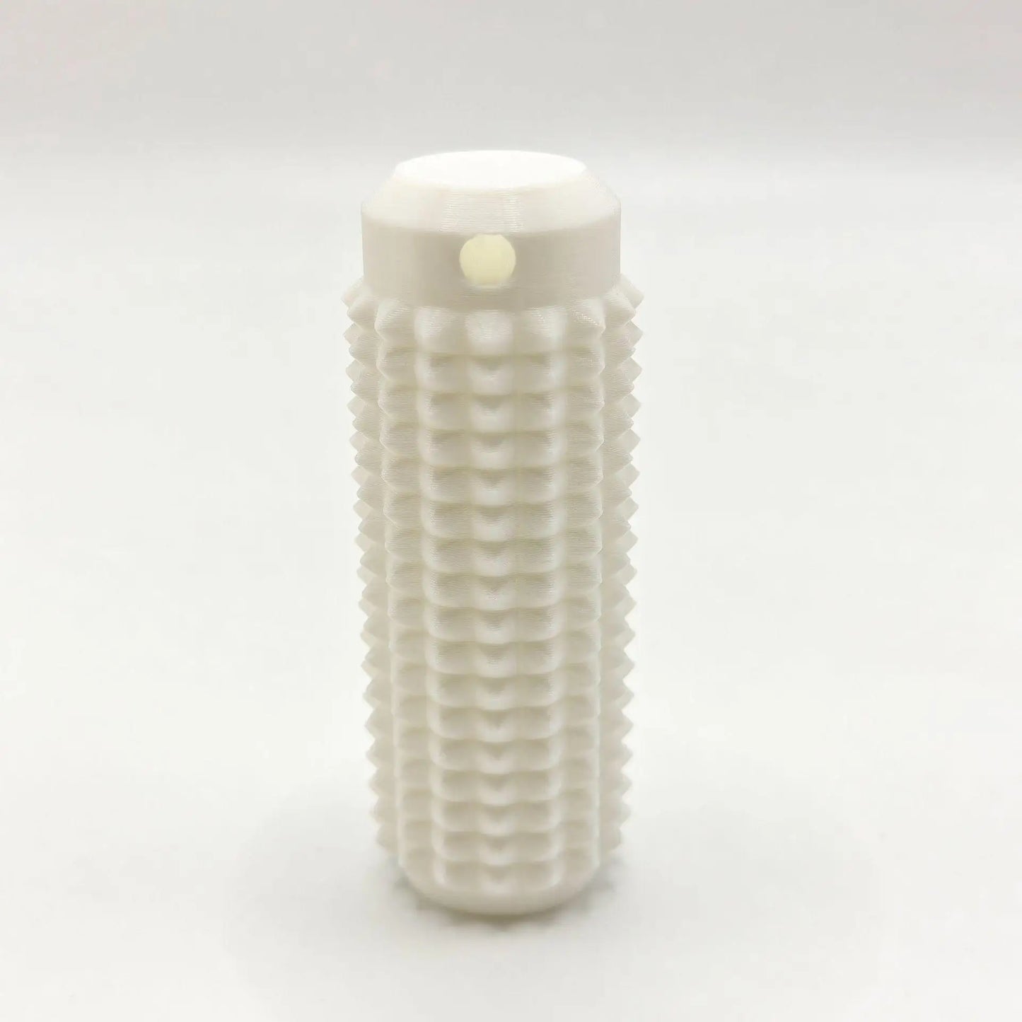 White mini grippie sensory toy with textured surface for tactile stimulation and grip practice