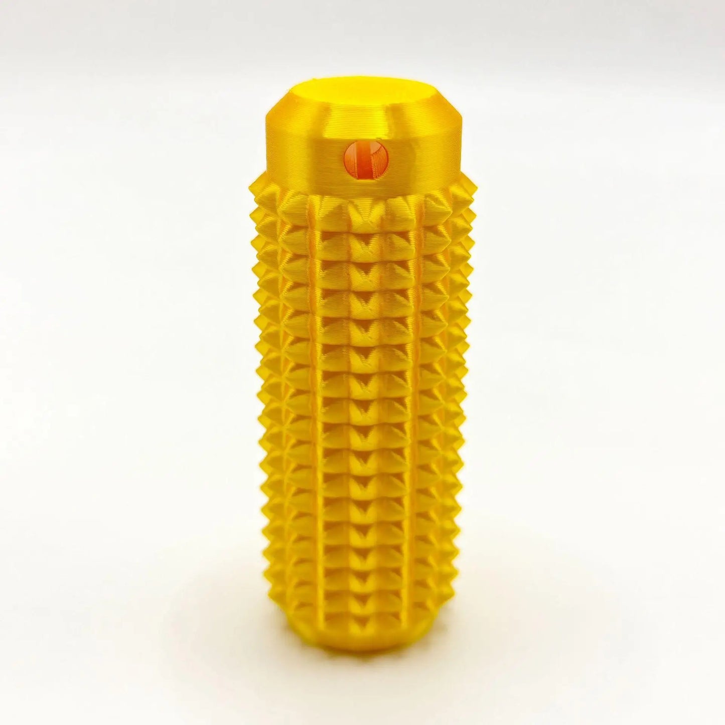 Yellow mini grippie sensory toy with textured surface for tactile stimulation and grip improvement