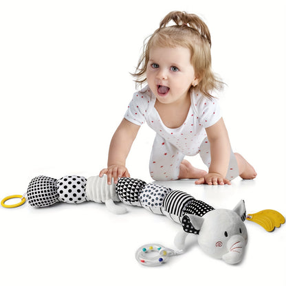 Baby playing with black and white musical stuffed animals for babies cat toy by Active Playthings