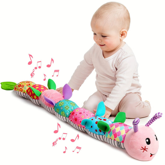 Baby playing with colorful musical stuffed animals for babies caterpillar toy from Active Playthings