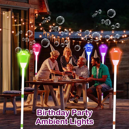 Outdoor birthday party with multicolor bubble street lamp sensory light stakes glowing around family table