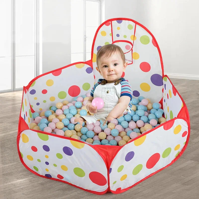 ActivePlaythings portable ball pit for toddlers with colorful balls and a smiling child enjoying playtime