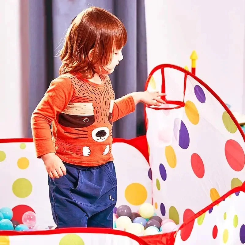 ActivePlaythings portable ball pit for toddlers with colorful polka dots and a child playing inside