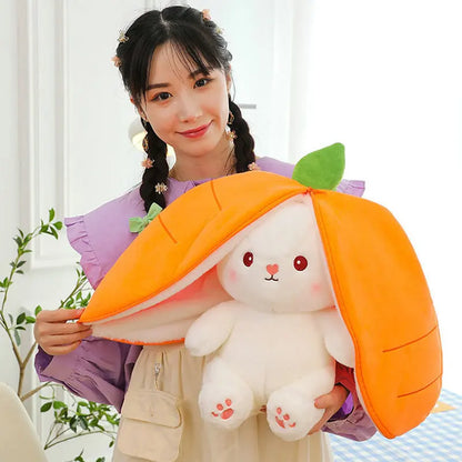 Smiling girl holding a reversible bunny plush toy in orange carrot costume for fun playtime