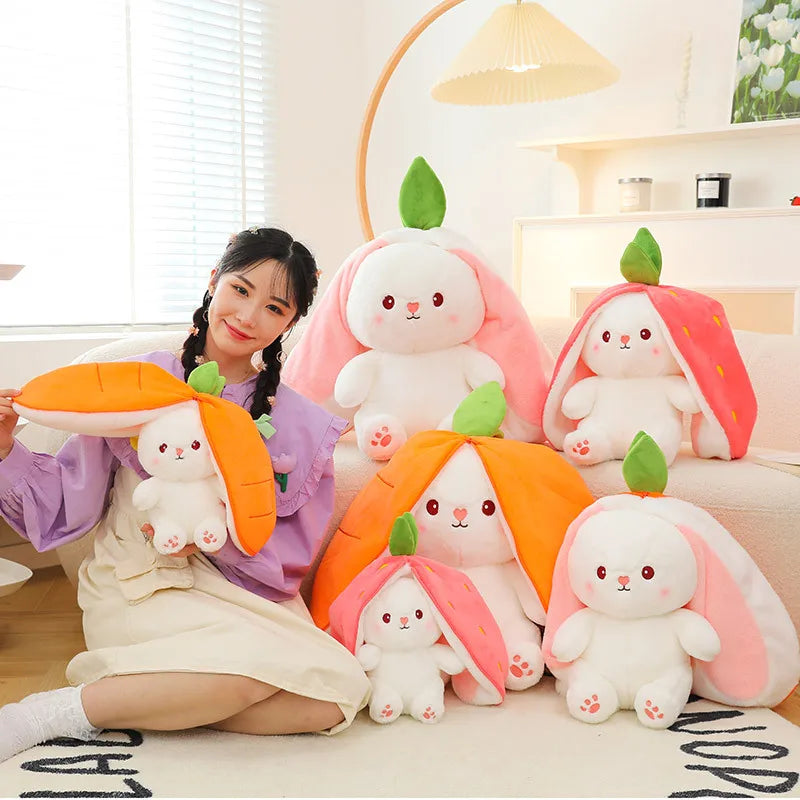 Group of colorful reversible bunny plushies in carrot and strawberry designs for playful decor