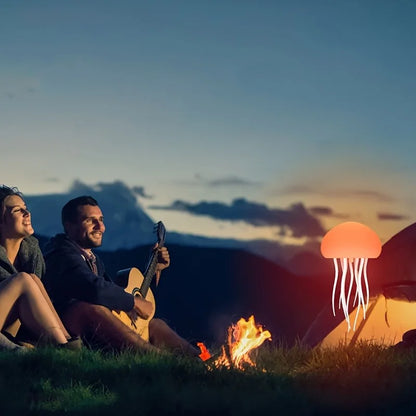 Sensory jellyfish night light illuminating a campsite with a couple enjoying music by the fire