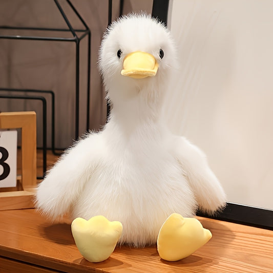 Active Playthings snuggly duck plush toy with soft white fur and yellow beak and feet sitting on wooden surface