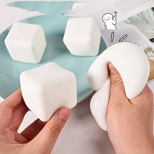 ActivePlaythings squishy tofu stress ball in hand showcasing soft, squishable design for stress relief